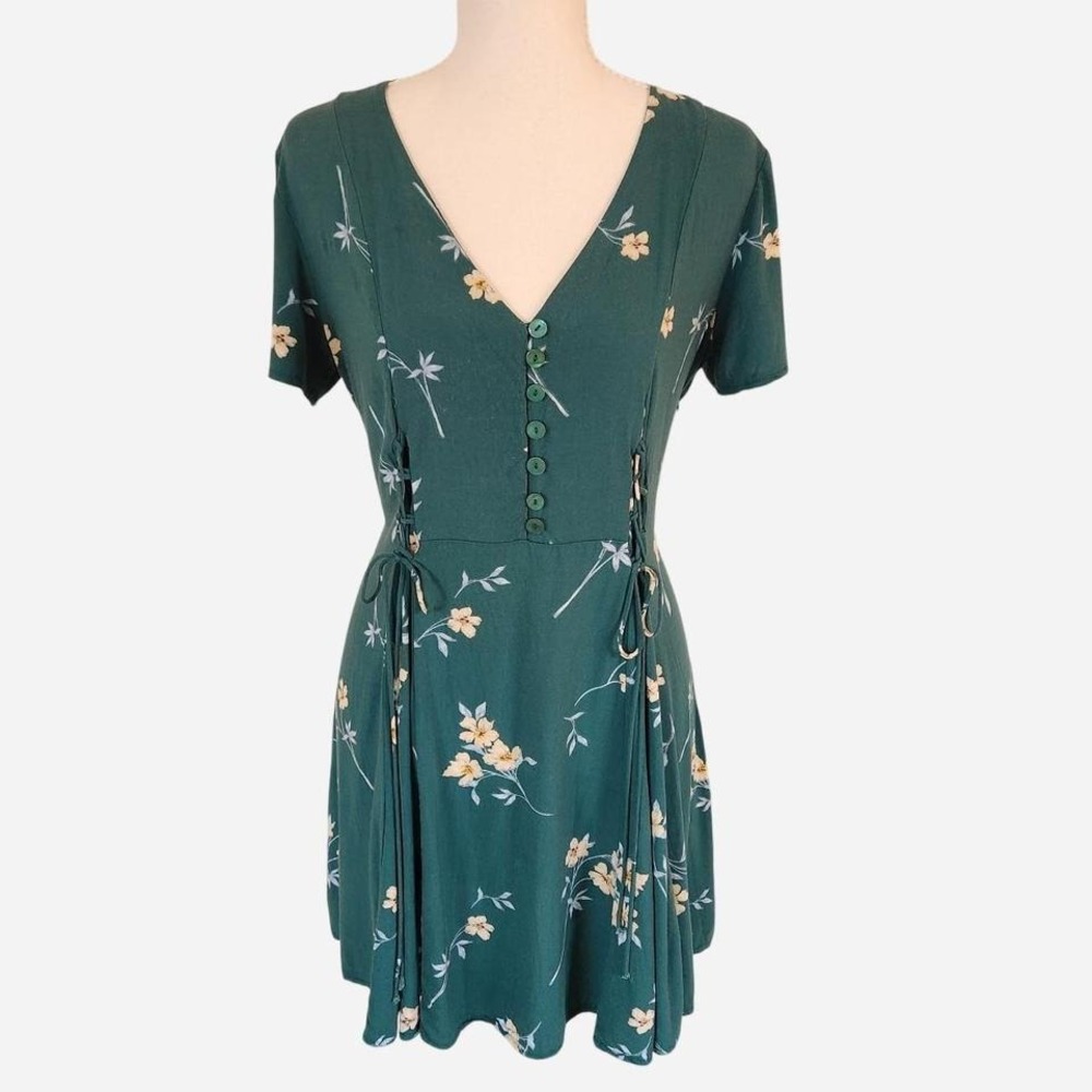 Green Lottie Moss cottage fairy floral dress with tie-up sides and button front